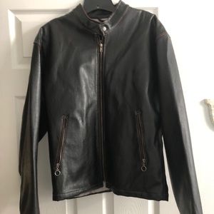 Faux leather jacket. Slightly distressed.